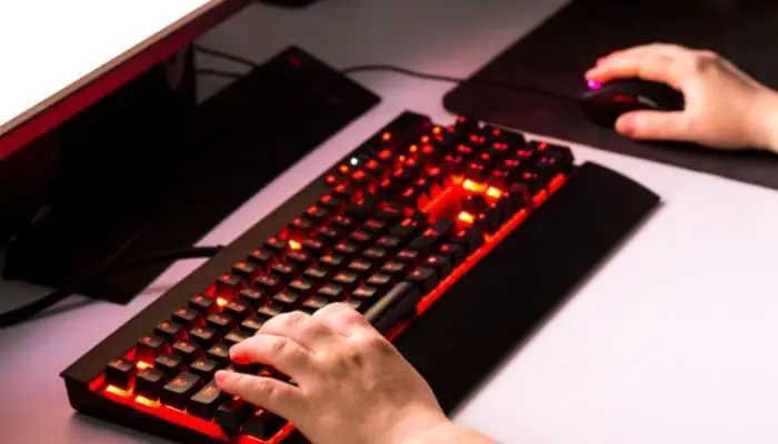 A gamer using a gaming mouse pad