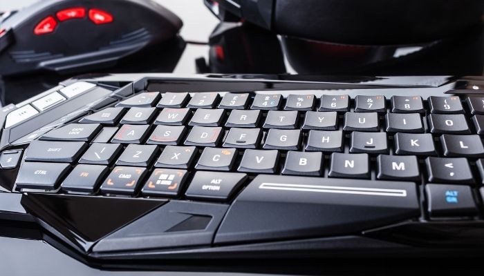 A grey and black gaming keyboard