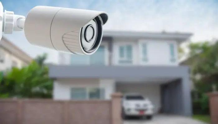 A security camera over looking somebody's property