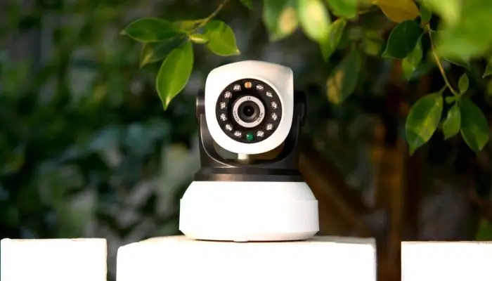 A home security camera on a wall