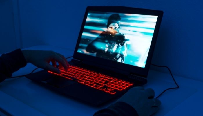 A gaming laptop with red backlit keys