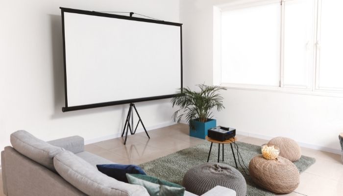 A projector screen in a bright room
