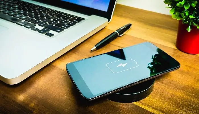 A phone charging on a wireless charger
