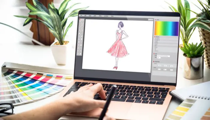 A fashion designer using a laptop