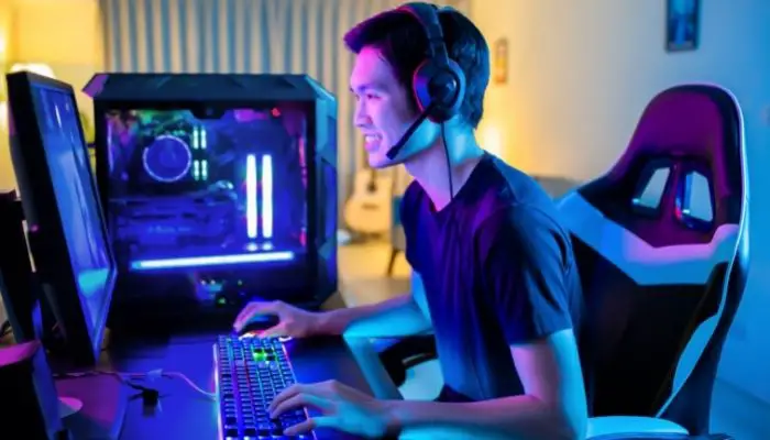 A man playing games on a gaming PC