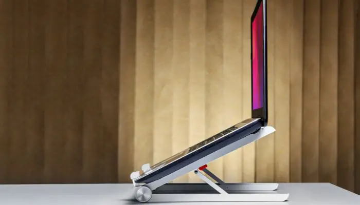 A laptop sitting on a laptop stand