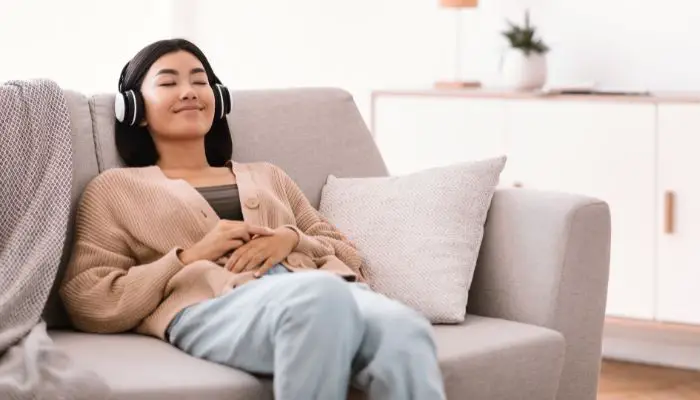 A woman listening to noise-cancelling headphones
